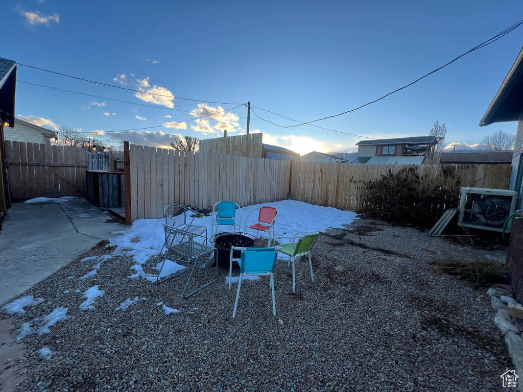 View of yard featuring a patio and a fire pit