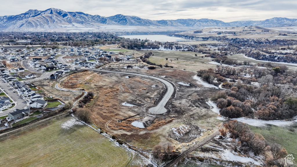 Birds eye view of property with a mountain view