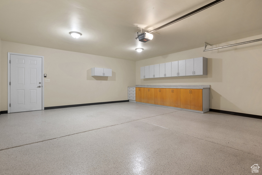 Garage featuring a garage door opener