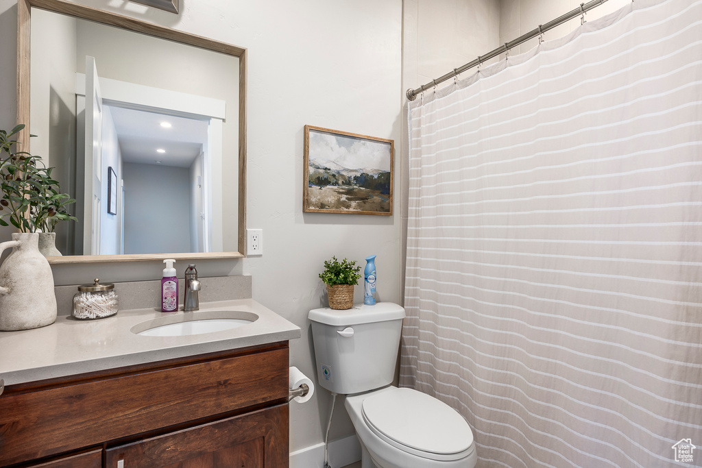Bathroom featuring vanity and toilet