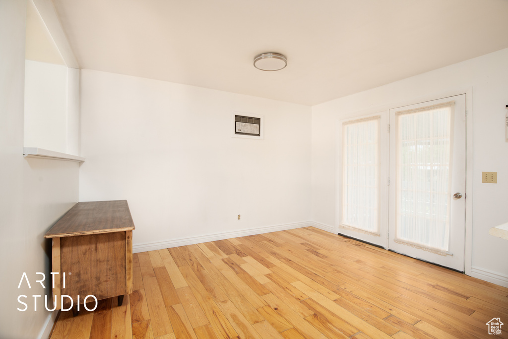 Unfurnished room with light hardwood / wood-style floors