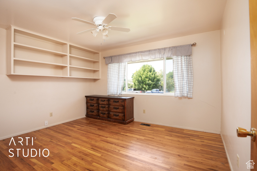 Spare room with ceiling fan and light hardwood / wood-style floors