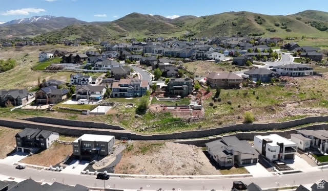Drone / aerial view with a residential view and a mountain view