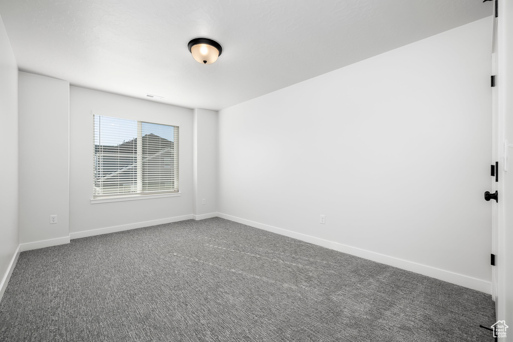 Unfurnished room with carpet floors