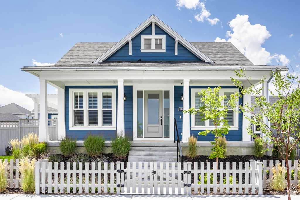 Bungalow featuring a porch