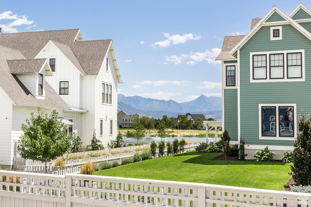 Exterior space featuring a pergola and a water and mountain view