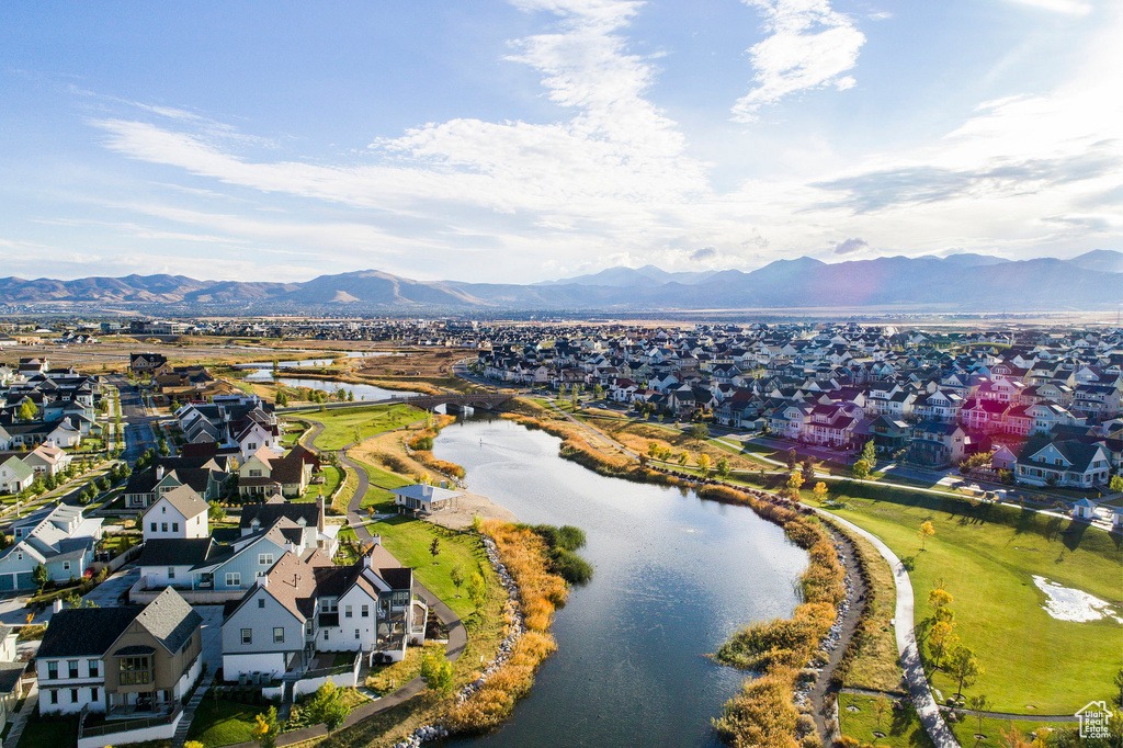 Drone / aerial view featuring a water and mountain view