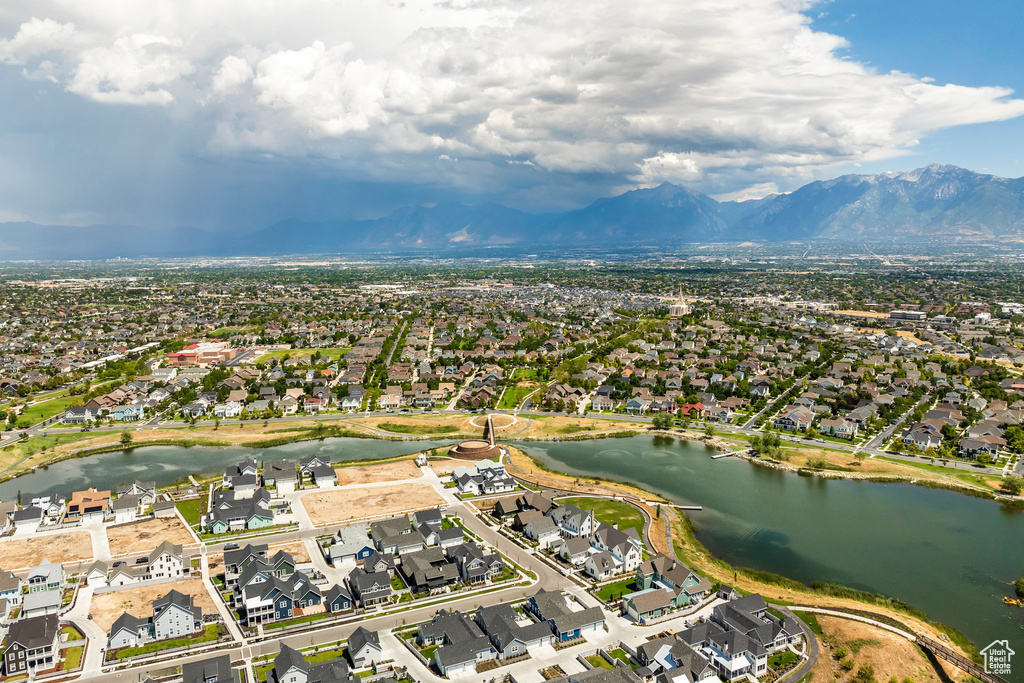 Drone / aerial view with a water and mountain view