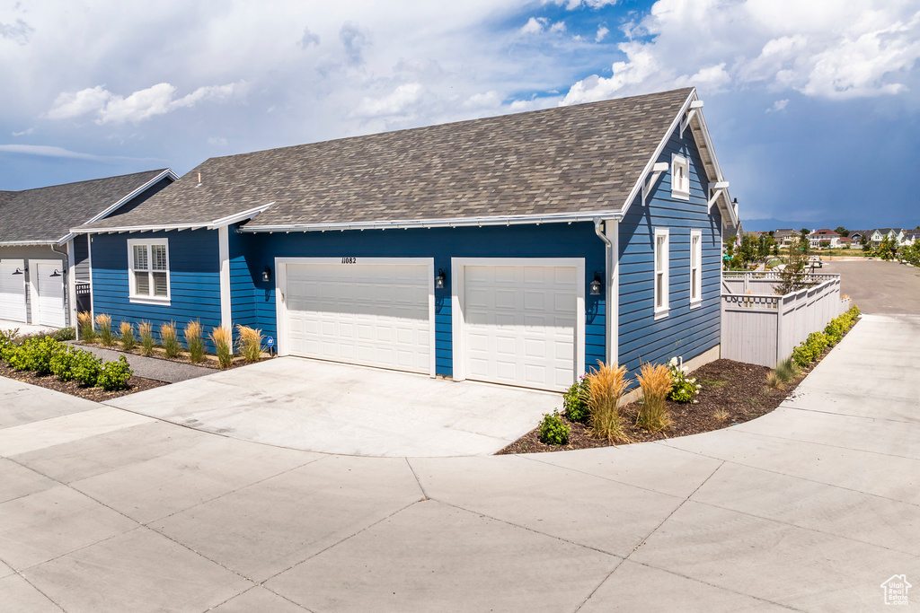Ranch-style home featuring a garage
