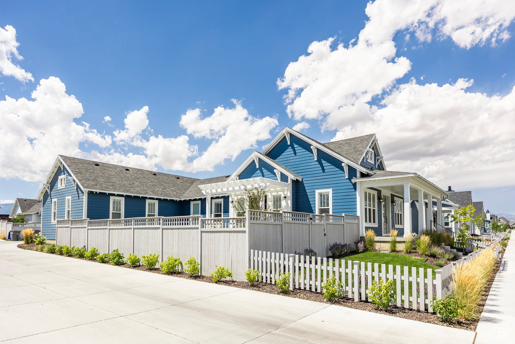 View of front of house featuring a pergola and a porch