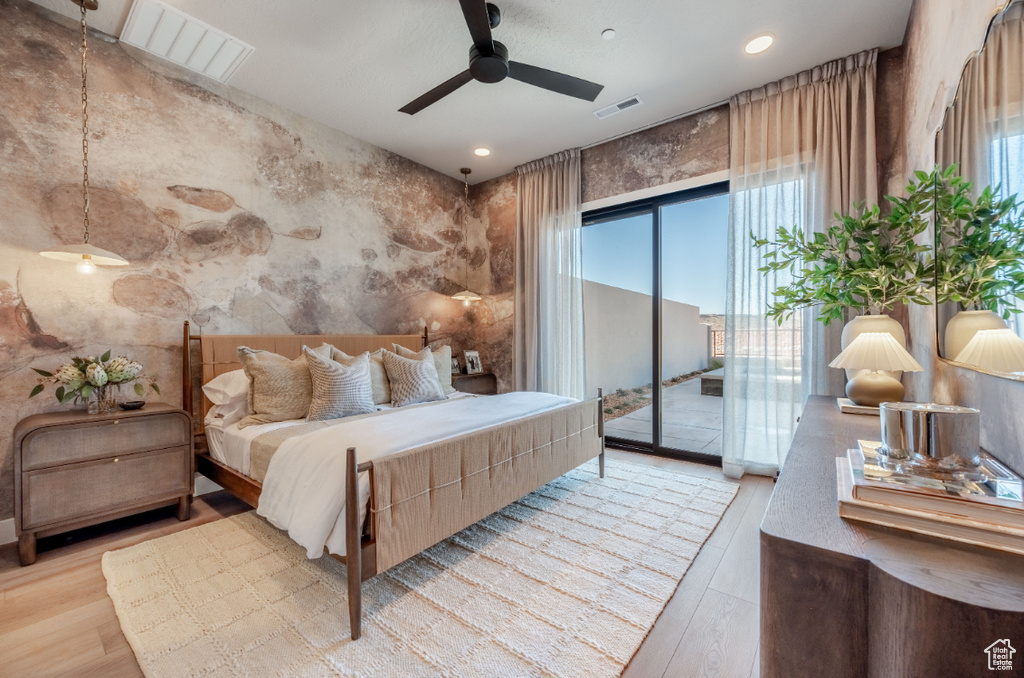 Bedroom with access to exterior, wood finished floors, ceiling fan, and recessed lighting