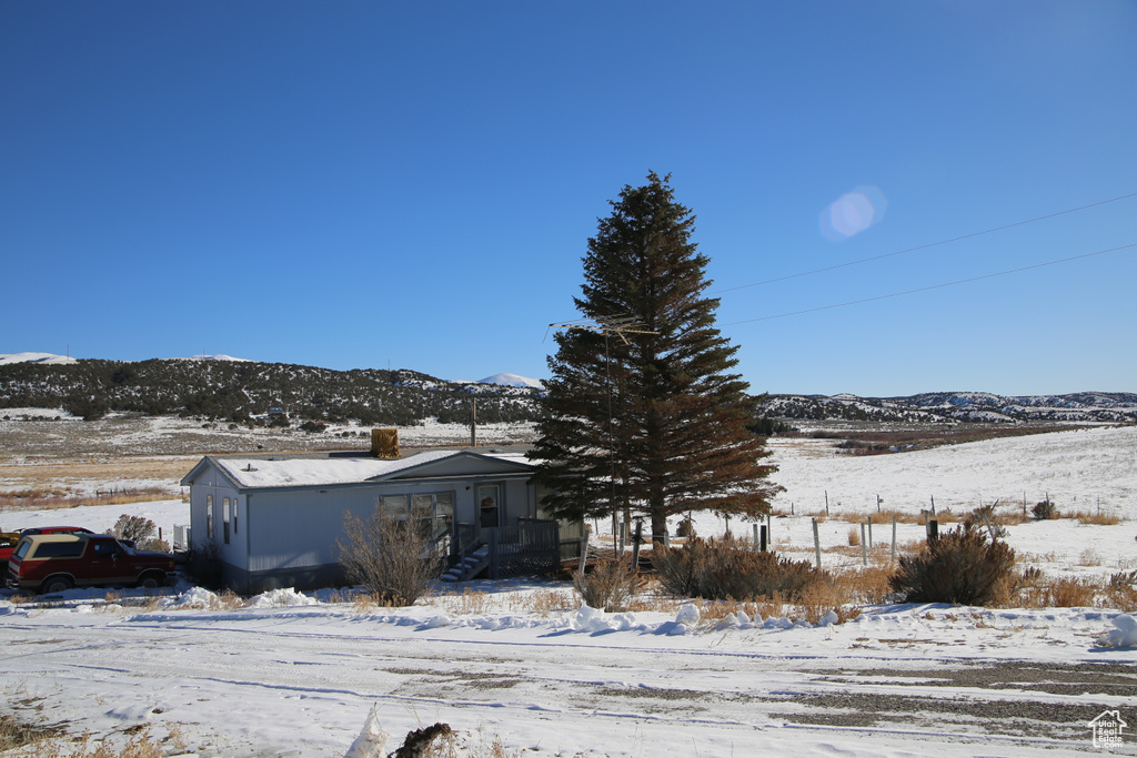 Exterior space featuring a mountain view