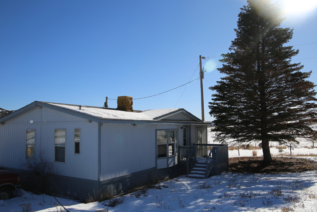 View of snow covered property