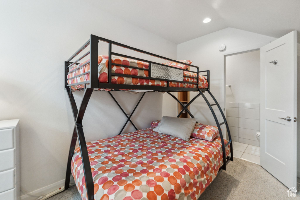 Carpeted bedroom with recessed lighting