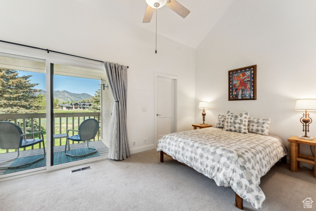 Bedroom with access to outside, carpet floors, baseboards, high vaulted ceiling, and ceiling fan