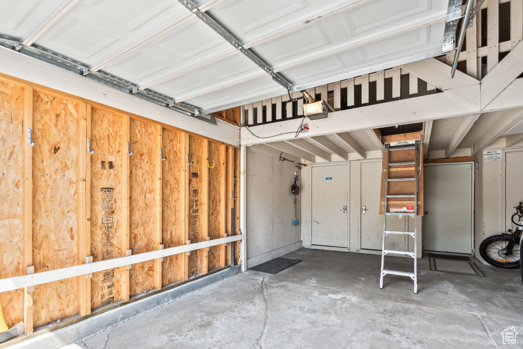 Garage featuring a garage door opener