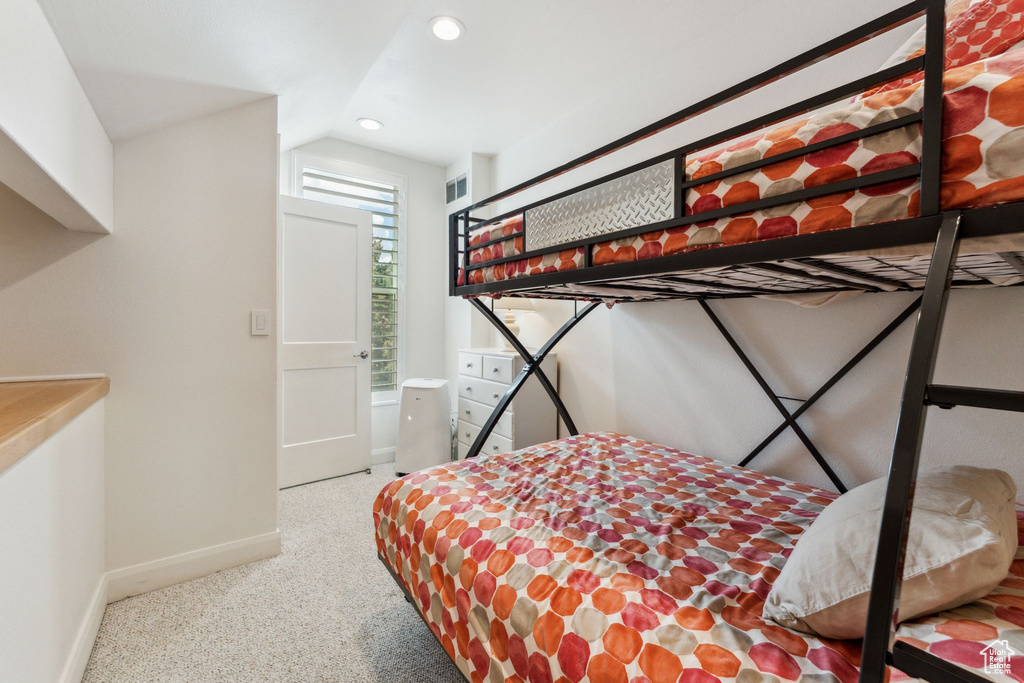 Bedroom with recessed lighting, baseboards, carpet, and lofted ceiling