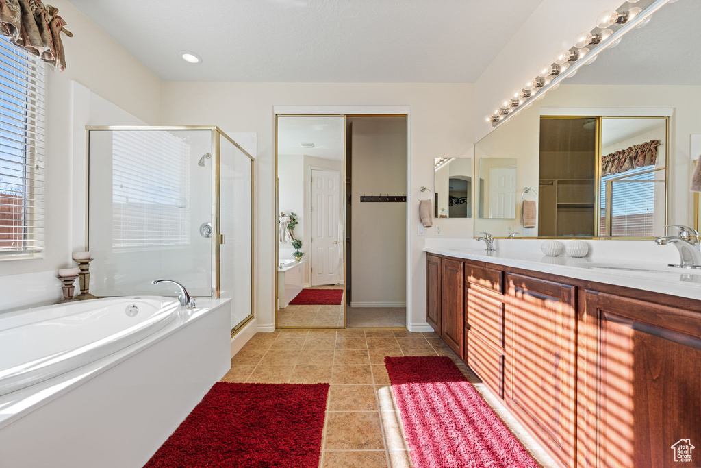 Bathroom with vanity, separate shower and tub, and tile patterned flooring
