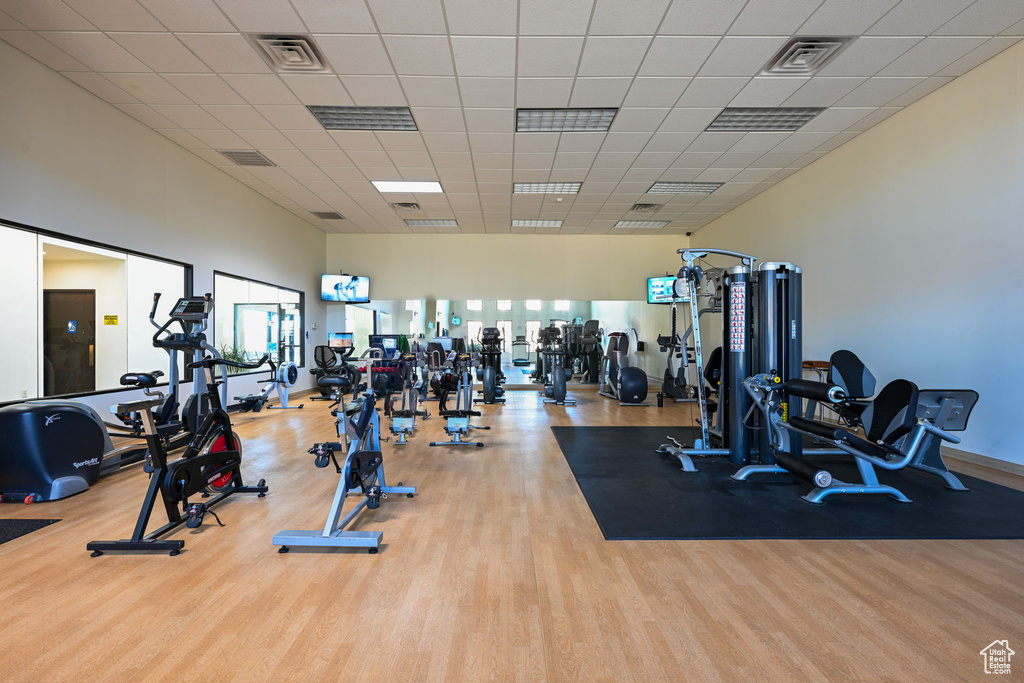 Exercise room featuring light wood-type flooring