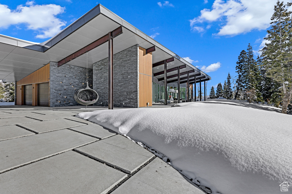 View of side of home with a garage