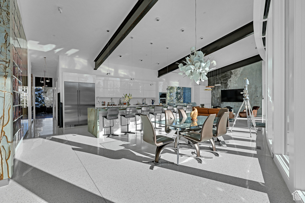 Dining room featuring beam ceiling