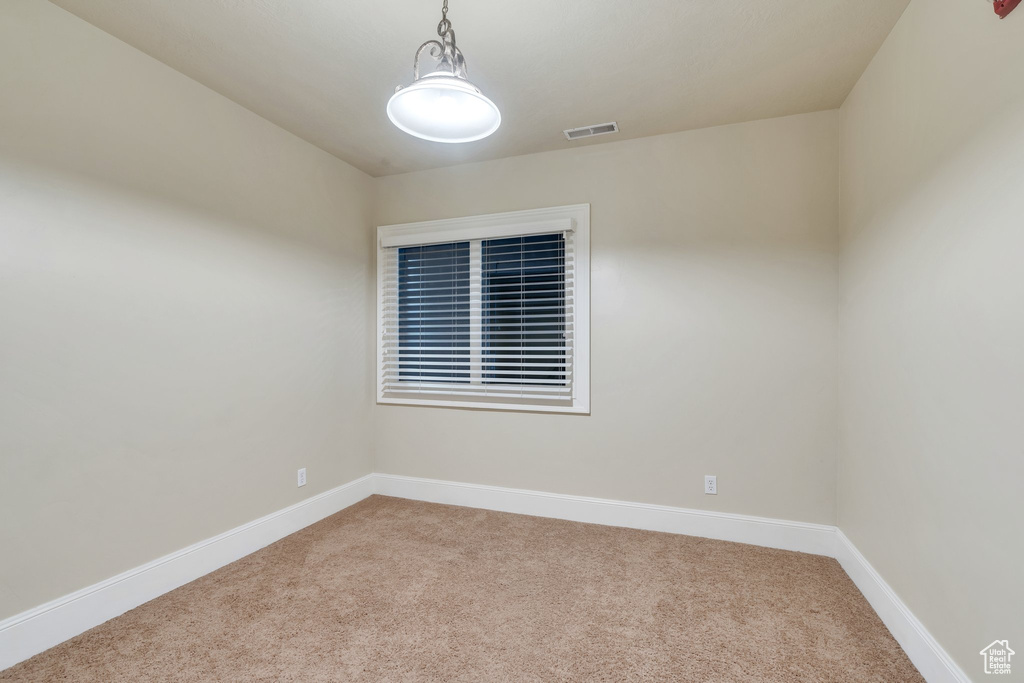 Unfurnished room featuring carpet