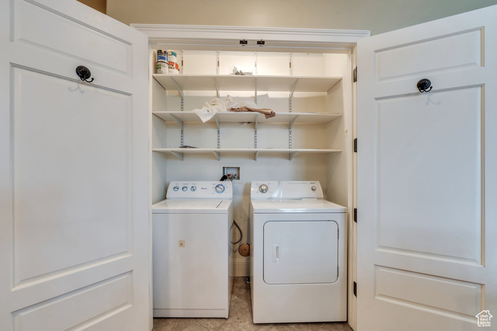 Washroom featuring washer and dryer