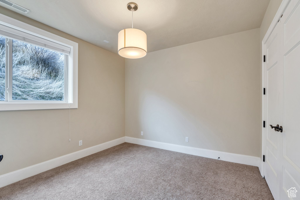 Empty room featuring carpet flooring