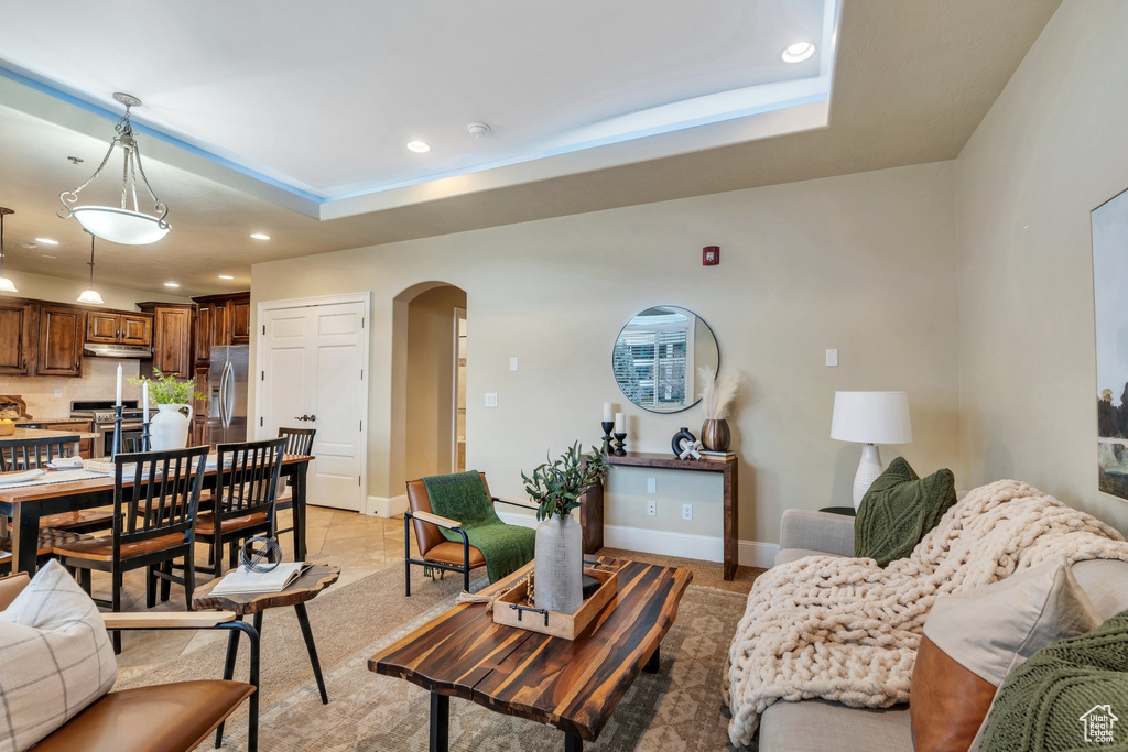 Living room featuring a tray ceiling