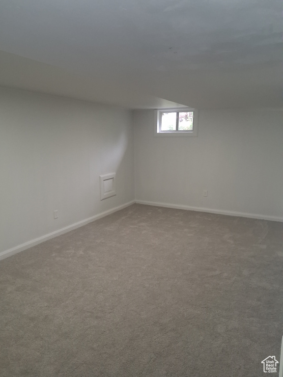 Basement with carpet and baseboards