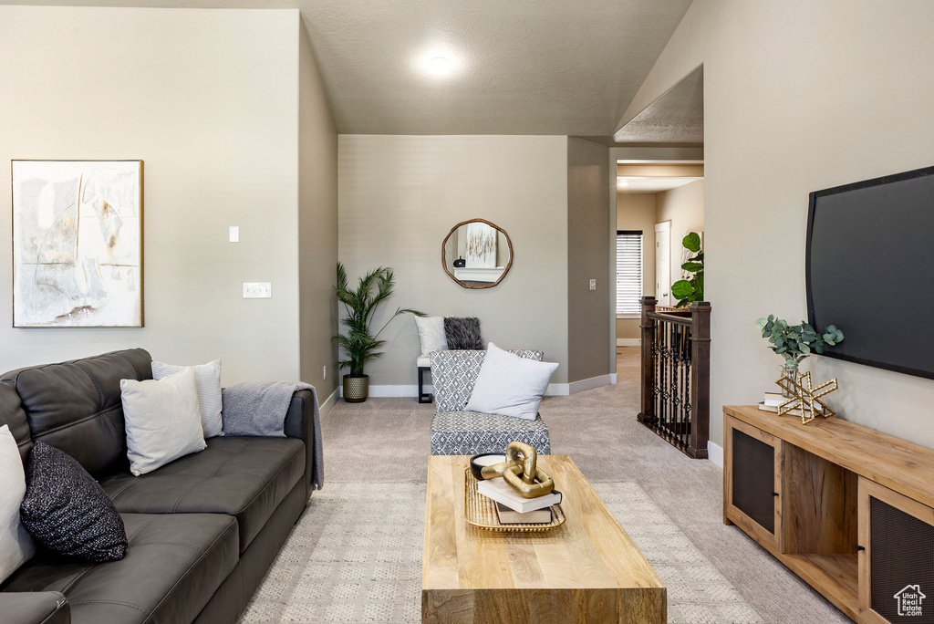 Living room featuring light carpet and baseboards