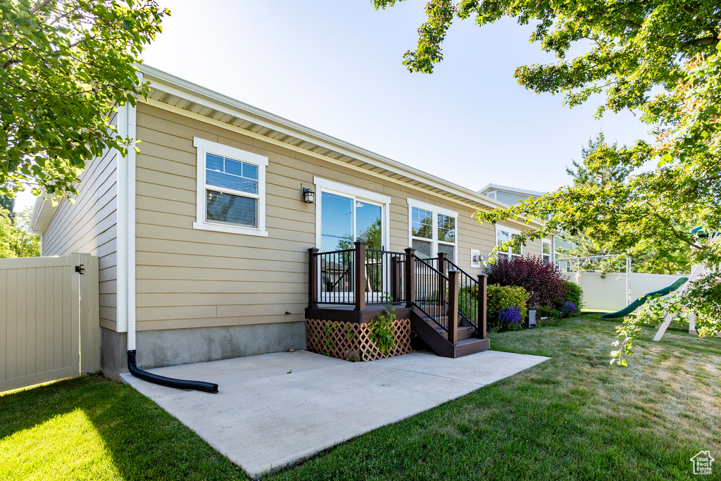 Rear view of property with a patio