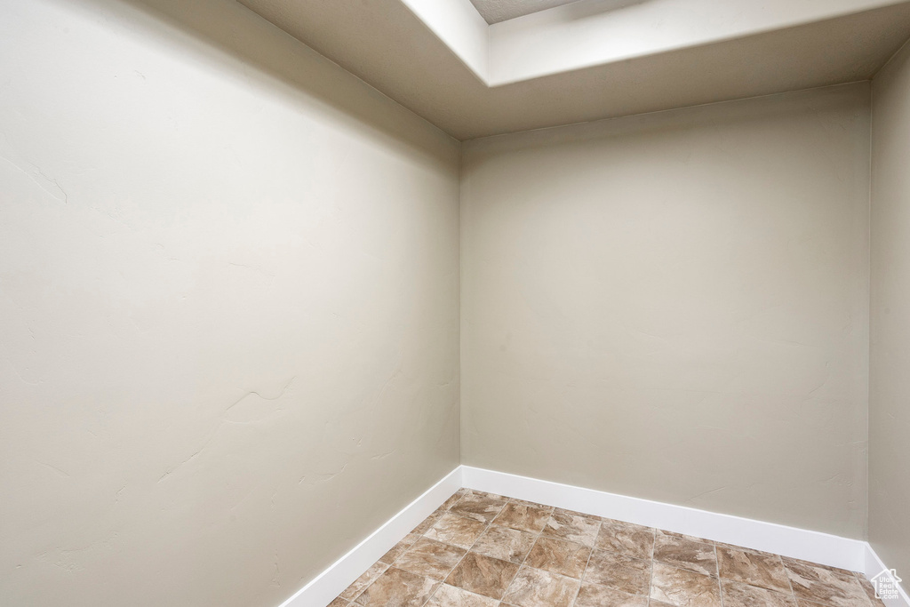 Unfurnished room with baseboards