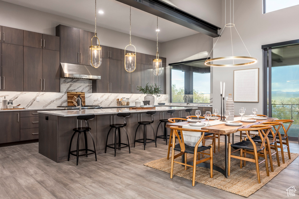 Dining area featuring light wood-style floors and recessed lighting