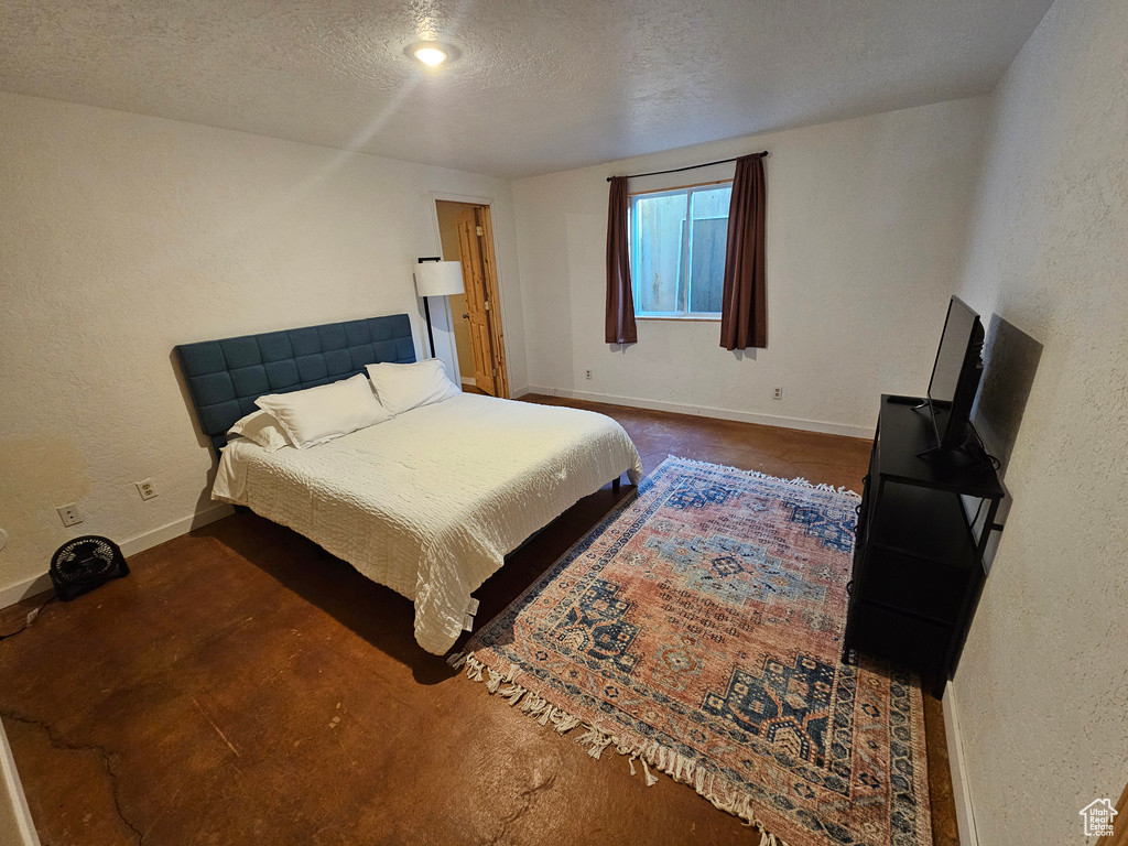 Bedroom featuring a textured ceiling