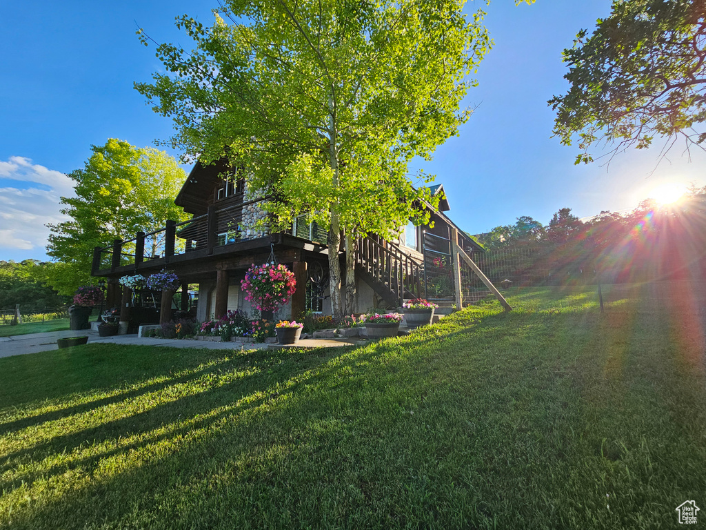 View of yard with a wooden deck