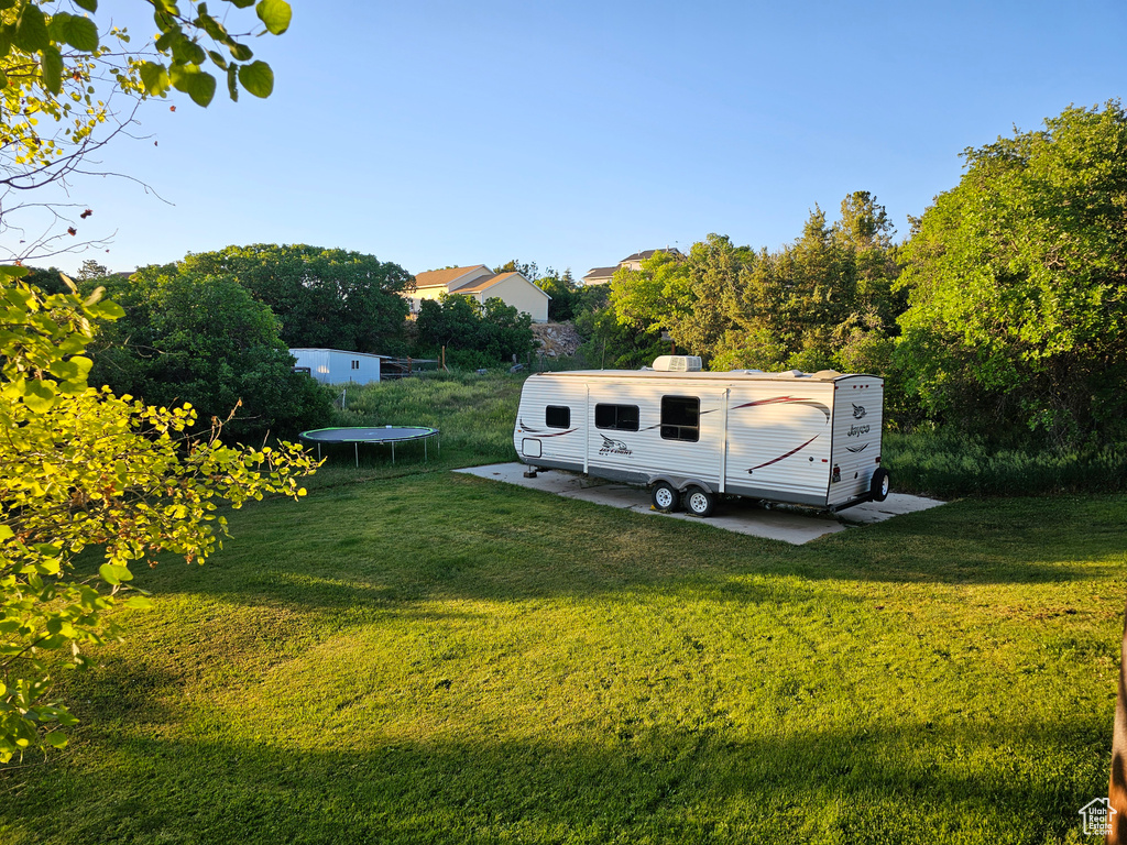 View of yard with a trampoline