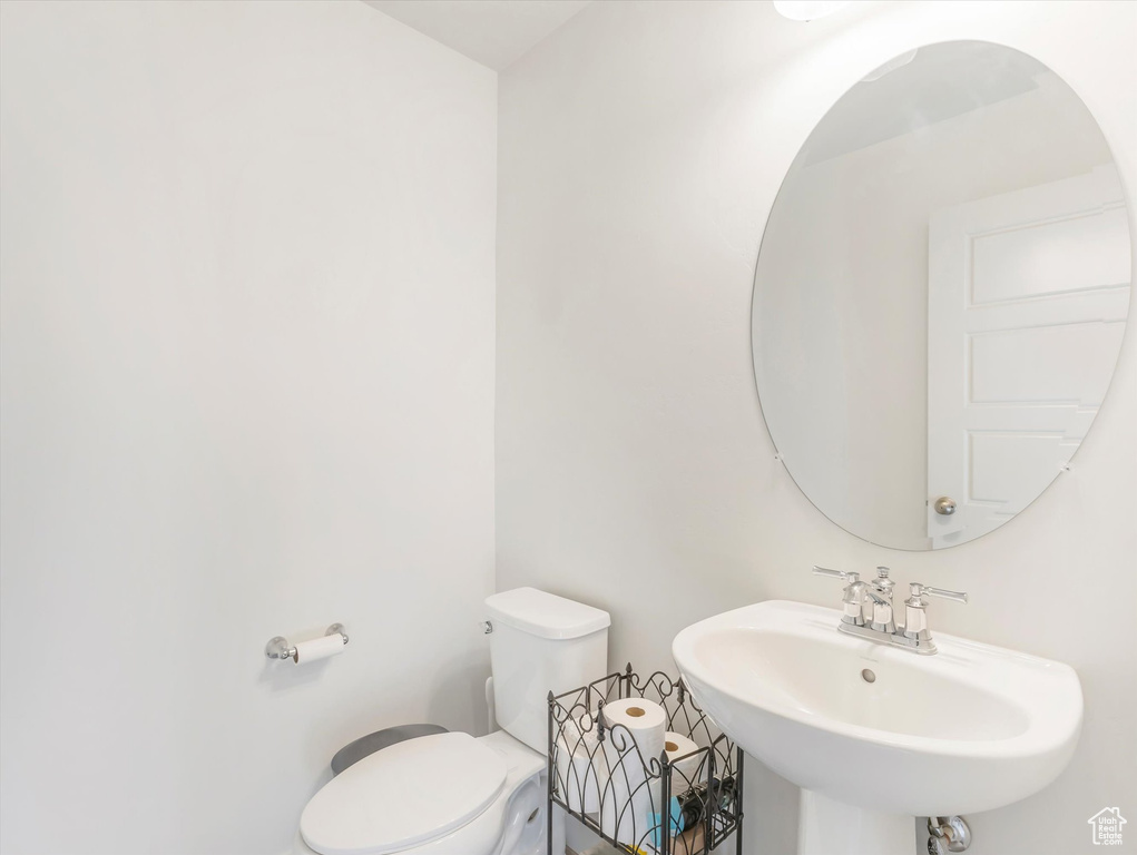 Bathroom featuring sink and toilet