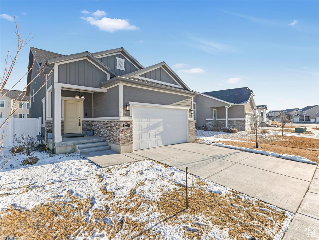 View of front of property featuring a garage