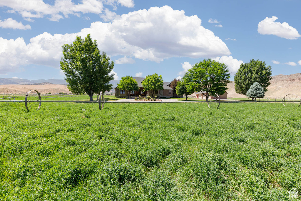 View of yard featuring a view of countryside and a mountain view