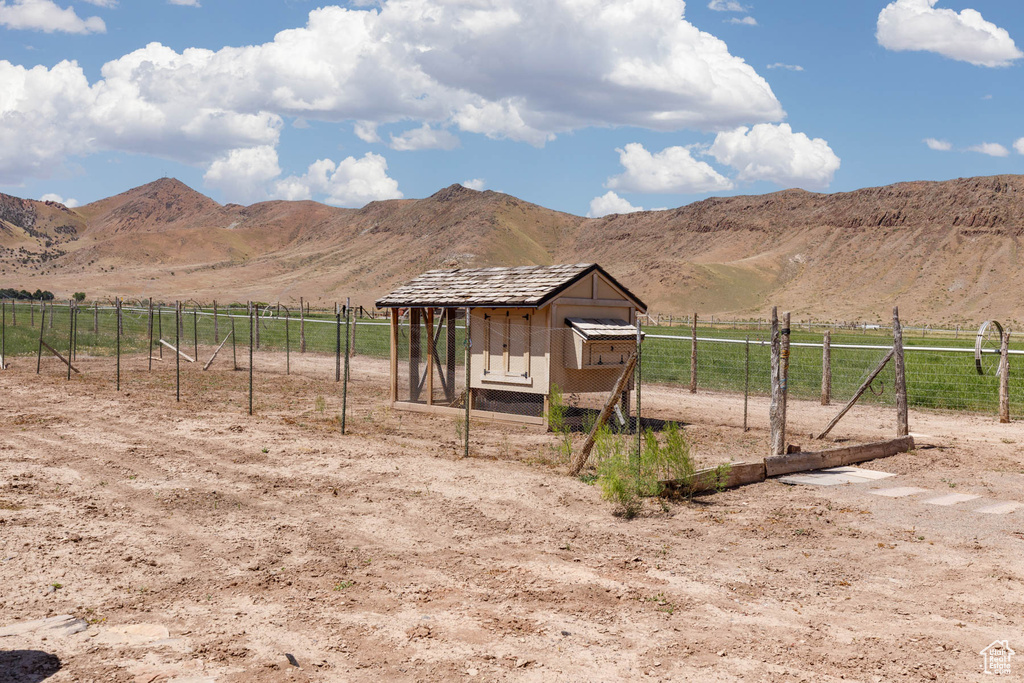 View of mountain backdrop featuring rural landscape