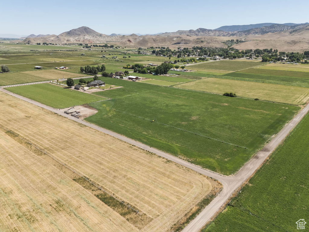 Overview of rural landscape featuring a mountain backdrop