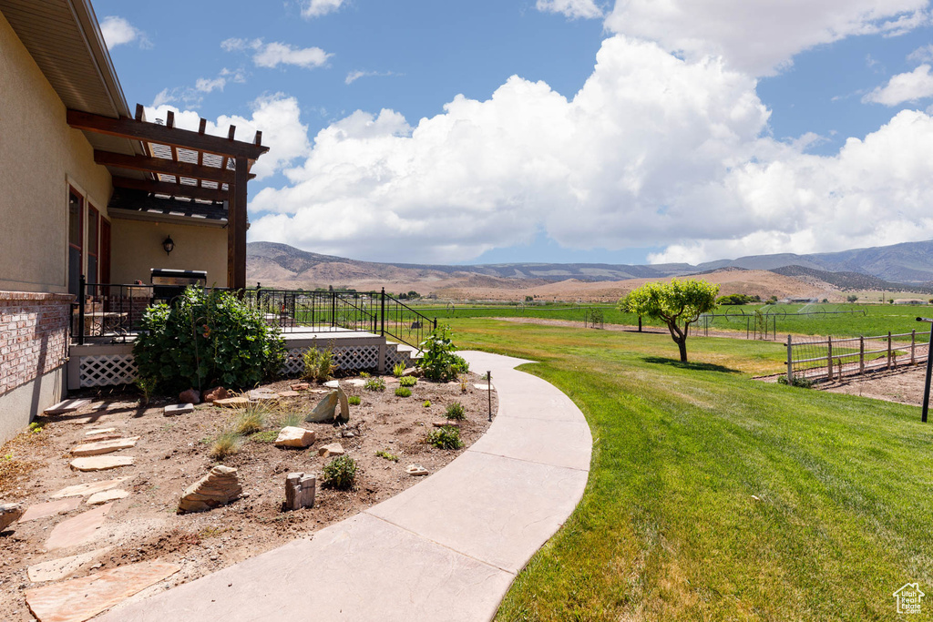 View of yard featuring a mountain view and a rural view