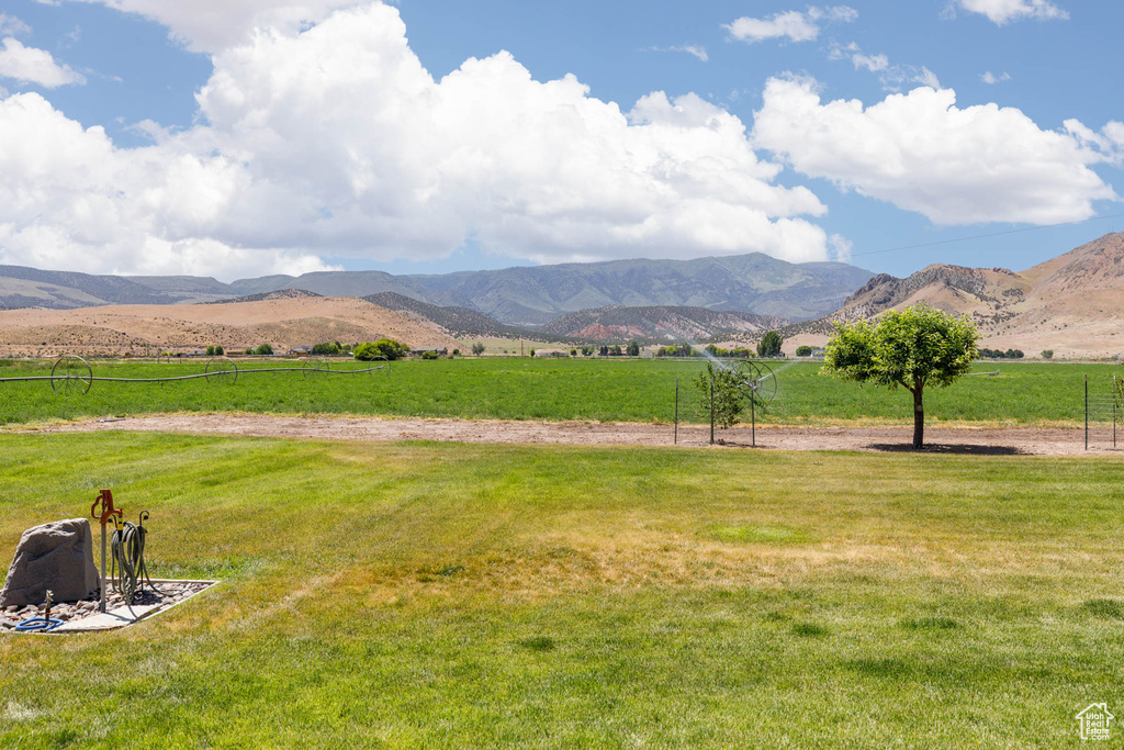 View of mountain backdrop with rural landscape