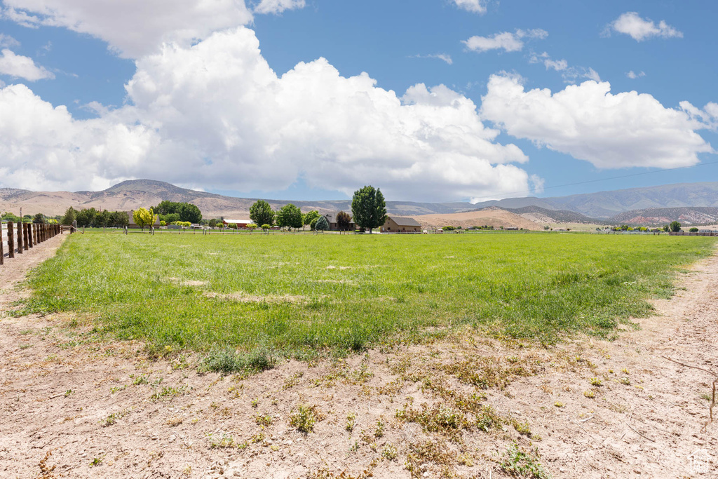 View of mountain backdrop featuring rural landscape