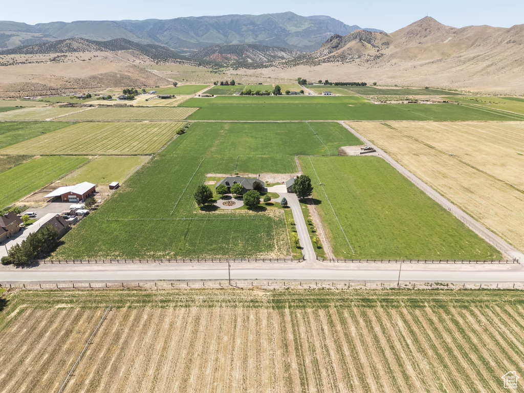 View of rural area with extensive farmland and a mountain backdrop