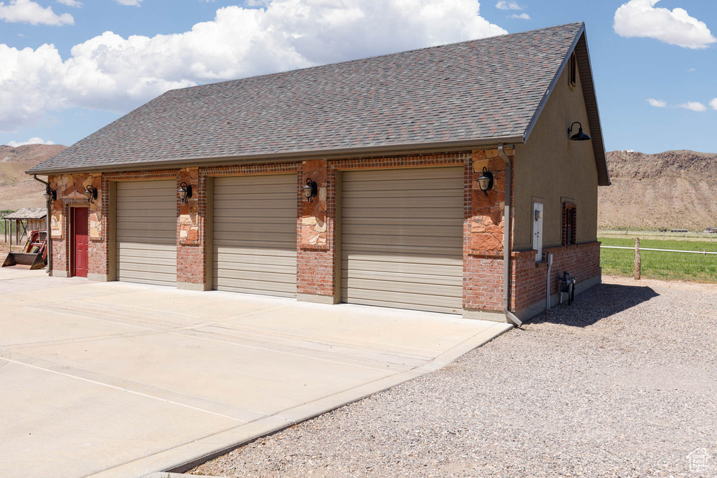 Detached garage with a mountain view