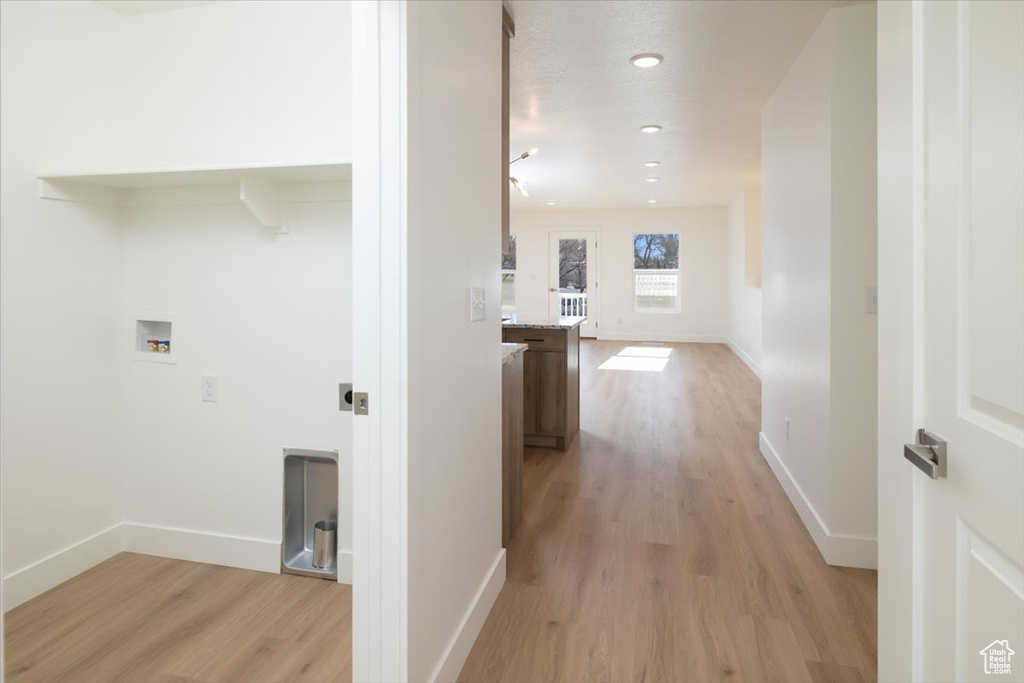 Corridor featuring light hardwood / wood-style floors