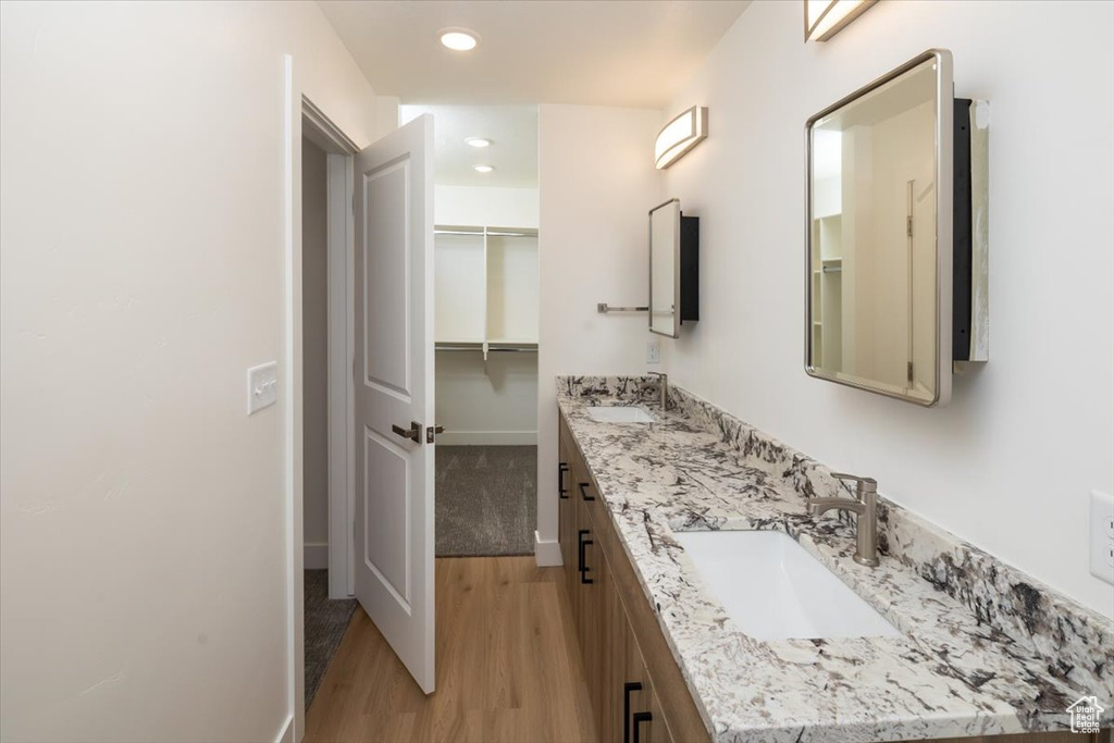 Bathroom featuring vanity and hardwood / wood-style floors