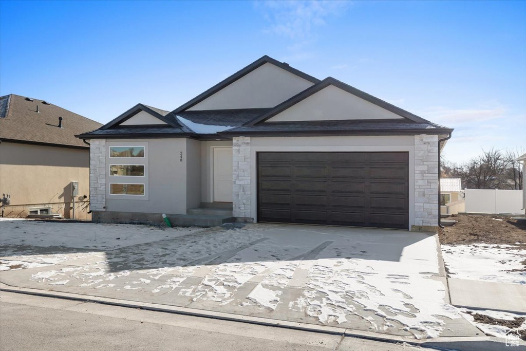 Single story home featuring a garage